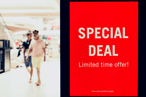 Special offer sign, Sale, offer, advertisement, shoppers in background,, time based deal
